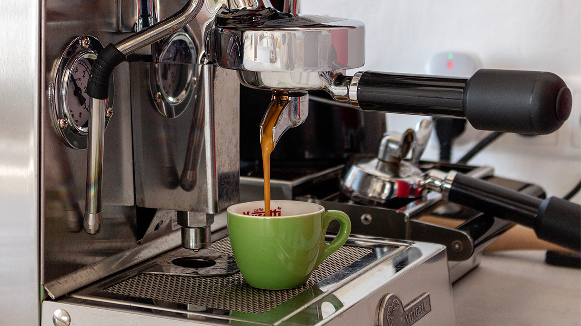 closeup of an espresso coming out of the tradional coffe machine (Photo)